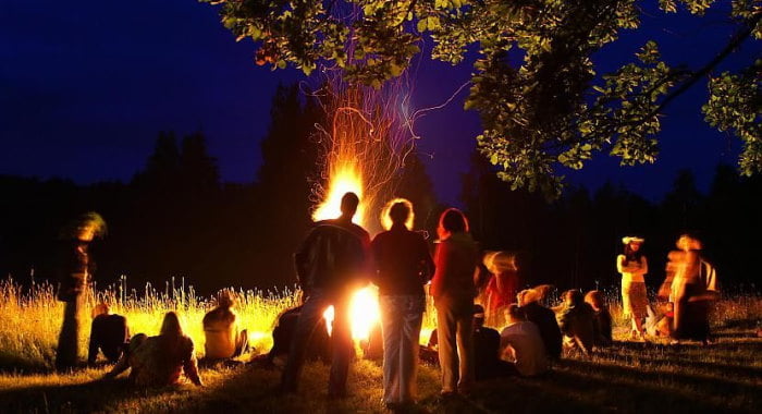 People celebrating around a bonfire