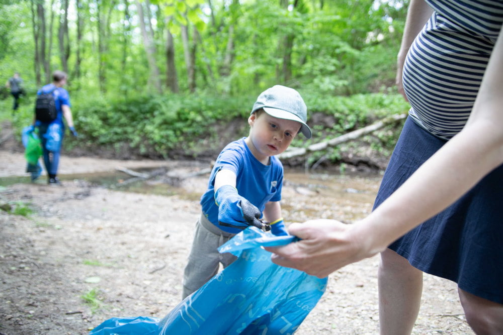 Child taking part in cleanup action